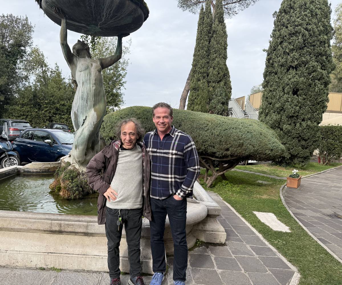 Dr. Barton standing with Dr. Giuseppe Marineo beside a fountain in Rome.