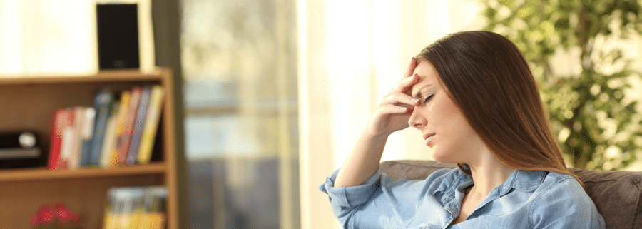 A woman experiences a headache