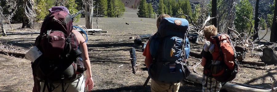 Three adults hiking