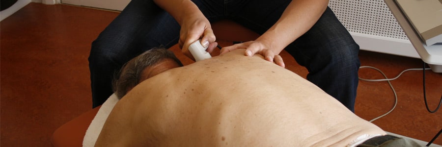 A man lays down for a chiropractic treatment