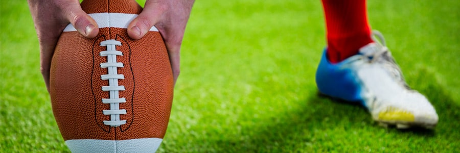 A man holds a football