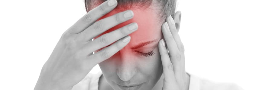 A woman experiences a headache